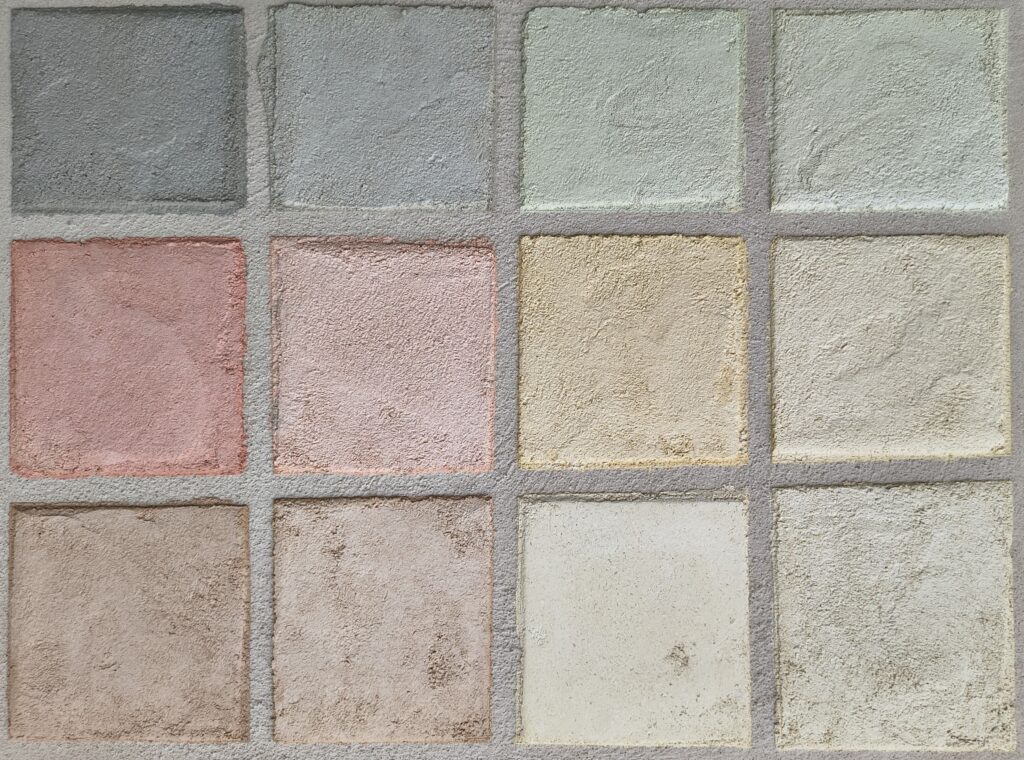 Palette di pigmenti naturali per intonaci in bioedilizia, ideali per ristrutturazioni e design di lusso.